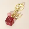 Fashnzfab Glittered Double Dice Keychain / Bag Charm In Multi