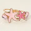 Fashnzfab Glittered Resin Double Starfish Hinged Bangle Bracelet In Pink