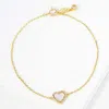 Fashnzfab Gold Dipped Cz Stone Paved Rim Heart Charm Pointed Bracelet Gold, White In Multi