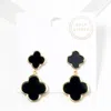 Fashnzfab Gold Dipped Double Quatrefoil Link Dangle Earrings In Black