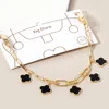 Fashnzfab Gold Dipped Quatrefoil Charm Station Paperclip Chain Bag Charm In Multi