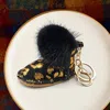 Fashnzfab Gold Foil Faux Fur Pom Pom Boot Keychain In Multi