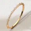 Fashnzfab Gold Plated Square Round Shaped Cz Stone Lined Statement Hinged Bangle Bracelet Gold In Gold