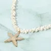 Fashnzfab Gold Starfish Pendant White Shell Bead Necklace In Gold