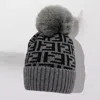 Fashnzfab Greek Geometric Patterned Pom Pom Beanie Hat In Gray
