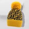 Fashnzfab Greek Geometric Patterned Pom Pom Beanie Hat In Yellow