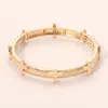 Fashnzfab Hammered Brushed Metal Cross Accent Stretch Bracelet - Worn Gold In Multi