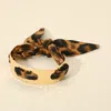 Fashnzfab Hammered Metal Cuff Leopard Print Fabric Bracelet In Gold
