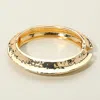 Fashnzfab Hammered Metal Sculptural Crescent Hinged Bangle Bracelet Gold In Gold