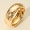 Fashnzfab Hammered Metal Wide Dome Hinged Bangle Bracelet In Gold