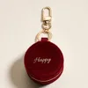 Fashnzfab Happy Embroidered Round Shaped Travel Jewelry Case Keychain Bag Charm In Burgundy