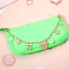 Fashnzfab Heart Bow Flower Charm Quatrefoil Pearl Station Bag Charm In Gold