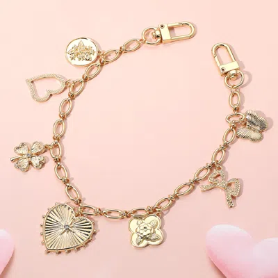 Fashnzfab Heart Butterfly Clover Bow Quatrefoil Flower Charm Station Bag Charm In Gold