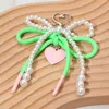 Fashnzfab Heart Charm Dangle Double Pearl Beaded Loop Bow Keychain / Bag Charm In Green
