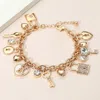 Fashnzfab Heart Key And Lock Charm Station Bracelet Gold In Gold