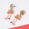 Fashnzfab Holiday Bow Accent Western Boot Dangle Earrings In Pink