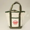 Fashnzfab Jrader Toes Message Embroidered Small Multi Purpose Canvas Tote Bag In Green