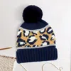 Fashnzfab Leopard Patterned Pom Pom Beanie Hat In Blue
