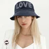 Fashnzfab Love Message Solid Reversible Bucket Hat In Black