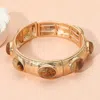 Fashnzfab Marbled Oval Stone Accent Hammered Metal Beaded Stretch Bracelet In Gold