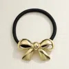 Fashnzfab Metal Bow Pointed Hair Band In Gold