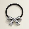 Fashnzfab Metal Bow Pointed Hair Band In Metallic