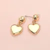 Fashnzfab Metal Heart Dangle Earrings - Gold In Gold