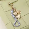 Fashnzfab Metal Heart Locket Cowboy Boot Hat Charm Floral Ceramic Ball Beaded Wristlet Keychain / Bag Charm In Multi
