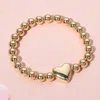 Fashnzfab Metal Heart Pointed Ball Stretch Bracelet In Gold