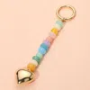Fashnzfab Metal Heart Tip Pointed Colorful Resin Round Beaded Bag Charm / Keychain In Multi
