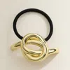 Fashnzfab Metal Knot Pointed Hair Band In Gold