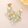 Fashnzfab Metal Open Circle Flower Dangle Earrings - Ivory In Gold