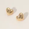 Fashnzfab Metal Puffy Heart Stud Earrings In Gold