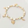 Fashnzfab Metal Shell Puka Shell Starfish Charm Station Ceramic Ball Beaded Stretch Bracelet - Gold, Pink In Gold