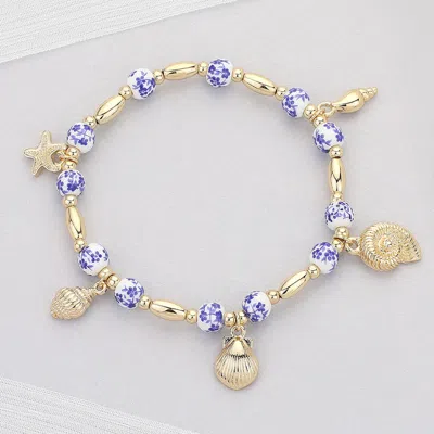 Fashnzfab Metal Shell Puka Shell Starfish Charm Station Ceramic Ball Beaded Stretch Bracelet In Gold