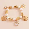 Fashnzfab Metal Shell Sand Dollar Pearl Starfish Charm Pearl Beaded Stretch Bracelet In Multi