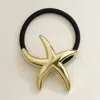 Fashnzfab Metal Starfish Pointed Hair Band In Gold