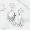 Fashnzfab Metal Tulip Flower Earrings - Worn Silver In White