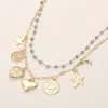 Fashnzfab Metal Zodiac Taurus Medal Star Heart Crescent Charm Station Faceted Beads Station Layered Necklace In Gold