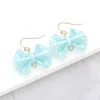 Fashnzfab Metallic Resin Bow Dangle Earrings - Light Blue In Blue