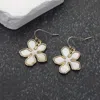 Fashnzfab Mother Of Pearl Flower Dangle Earrings In Gold