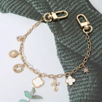 Fashnzfab Mother Of Pearl Quatrefoil Pearl Heart Charm Station Bag Charm In Silver