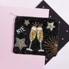 Fashnzfab Nye Message Champagne Star Sequin Beaded Mini Pouch Bag In Black