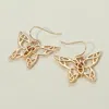 Fashnzfab Open Metal Butterfly Dangle Earrings In Gold