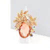Fashnzfab Oval Stone Accented Leaf Cluster Stretch Ring In Pink