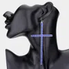 Fashnzfab Oversized Crystal Cross Earrings In Blue