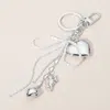 Fashnzfab Pearl Beaded Bow Metal Heart Cupid Embellished Bag Charm / Keychain In Silver