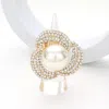 Fashnzfab Pearl Centered Rhinestone Paved Flower Stretch Ring - Cream, Gold In Gold