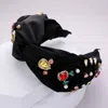 Fashnzfab Pearl Multi Stone Embellished Twisted Headband In Black