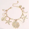 Fashnzfab Pearl Paved Shell Crescent Metal Starfish Heart Evil Eye Virgin Mary Charm Station Bracelet Gold, Wh In Multi